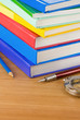 new books and pens on wood new books and pens on wood