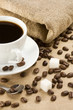 cup of coffee and roasted beans