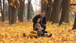 Family of 4 at autumn having fun