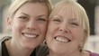 Video: Happy mother and daughter hugging, looking at camera Happy mother and daughter hugging, looking at camera