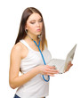 Young girl with laptop and stethoscope