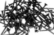 Drywall screws on isolated white background