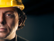 Photo: Portrait of adult manual worker with helmet Portrait of adult manual worker with helmet