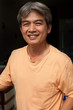 face of asian man smiling with glad emotion