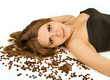 Beautiful woman lie on coffee beans