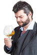 Businessman looking at a glass of whisky Businessman looking at a glass of whisky