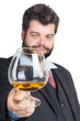Businessman looking at a glass of whisky Businessman looking at a glass of whisky
