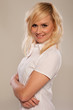Attractive blonde female posing with arms crossed