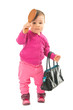 Baby girl with comb and hand bag over white background Baby girl with comb and hand bag over white background