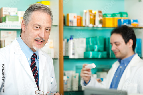 Photo: Portrait of pharmacists in a store Portrait of pharmacists in a store