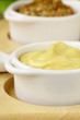 French mustard sauce in white gravy boat