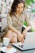 Modern pretty woman having breakfast or lunch at sidewalk cafe Modern pretty woman having breakfast or lunch at sidewalk cafe