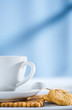 cup with spoon and cookies