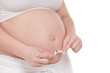 Pregnant belly with cigarettes
