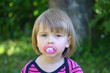 baby and pink soother
