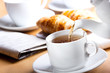 Pouring tea into cup of tea