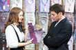 man and assistant at apparel clothes shopping