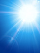Blue sky with sun and lens flare