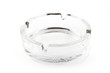 Empty glass ash tray on white