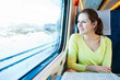Young woman traveling by train