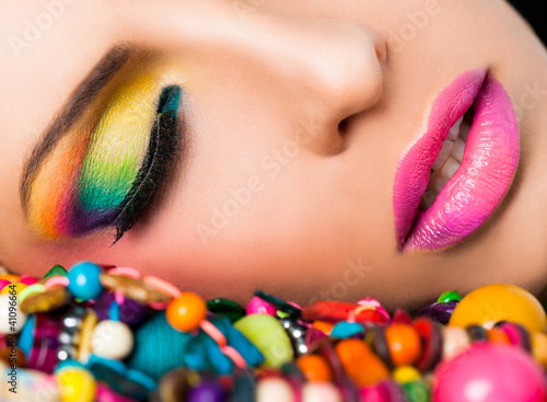Photo: Woman face colourful make-up lips Woman face colourful make-up lips
