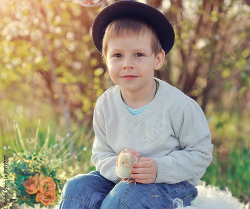 Photo: the boy with a chicken the boy with a chicken