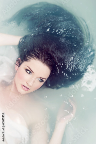Photo: Woman relaxing in water Woman relaxing in water