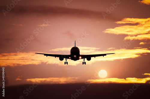 Photo: plane in the sunset sky plane in the sunset sky