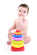 Baby thinking with colourful toy