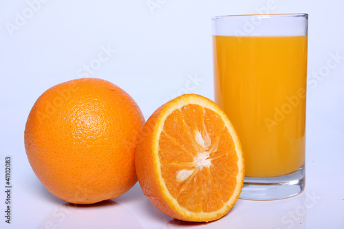 Photo: Fresh Orange juice isolated on white background Fresh Orange juice isolated on white background