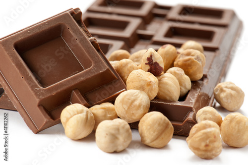 Photo: chocolate bar with nuts on white background chocolate bar with nuts on white background