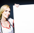 Smiling healthcare professional with a blank board