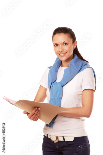 Photo: A young woman holding papers A young woman holding papers