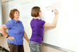 Stock Photo of Student and Teacher at Blackboard Stock Photo of Student and Teacher at Blackboard