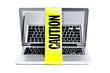Foto: Laptop computer with caution tape wrapped around it Laptop computer with caution tape wrapped around it