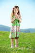 Little girl at green field