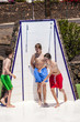 boys have fun unter the pool shower boys have fun unter the pool shower