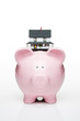 Toy house on a piggy bank