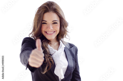 Photo: Young business woman giving thumbs up Young business woman giving thumbs up