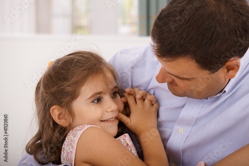 Photo: Father and little daughter embracing Father and little daughter embracing