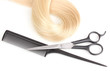Shiny blond hair with hair cutting shears and comb isolated