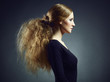 Portrait of a beautiful young woman with curly red hair Portrait of a beautiful young woman with curly red hair