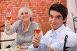 Man and grandmother in restaurant Man and grandmother in restaurant