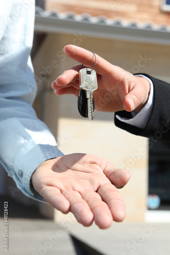 Photo: Agent handing over house keys Agent handing over house keys