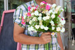 young man hold with flowers young man hold with flowers