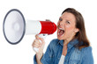 Photo: junge frau schreit laut ins megafon junge frau schreit laut ins megafon
