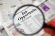 Photo: Magnifying glass over "Job Opportunity" text Magnifying glass over "Job Opportunity" text