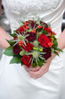 Photo: bride holding a bouquet of roses bride holding a bouquet of roses