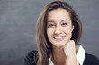 Close-up of a young woman smiling