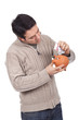 man holding a piggy bank man holding a piggy bank